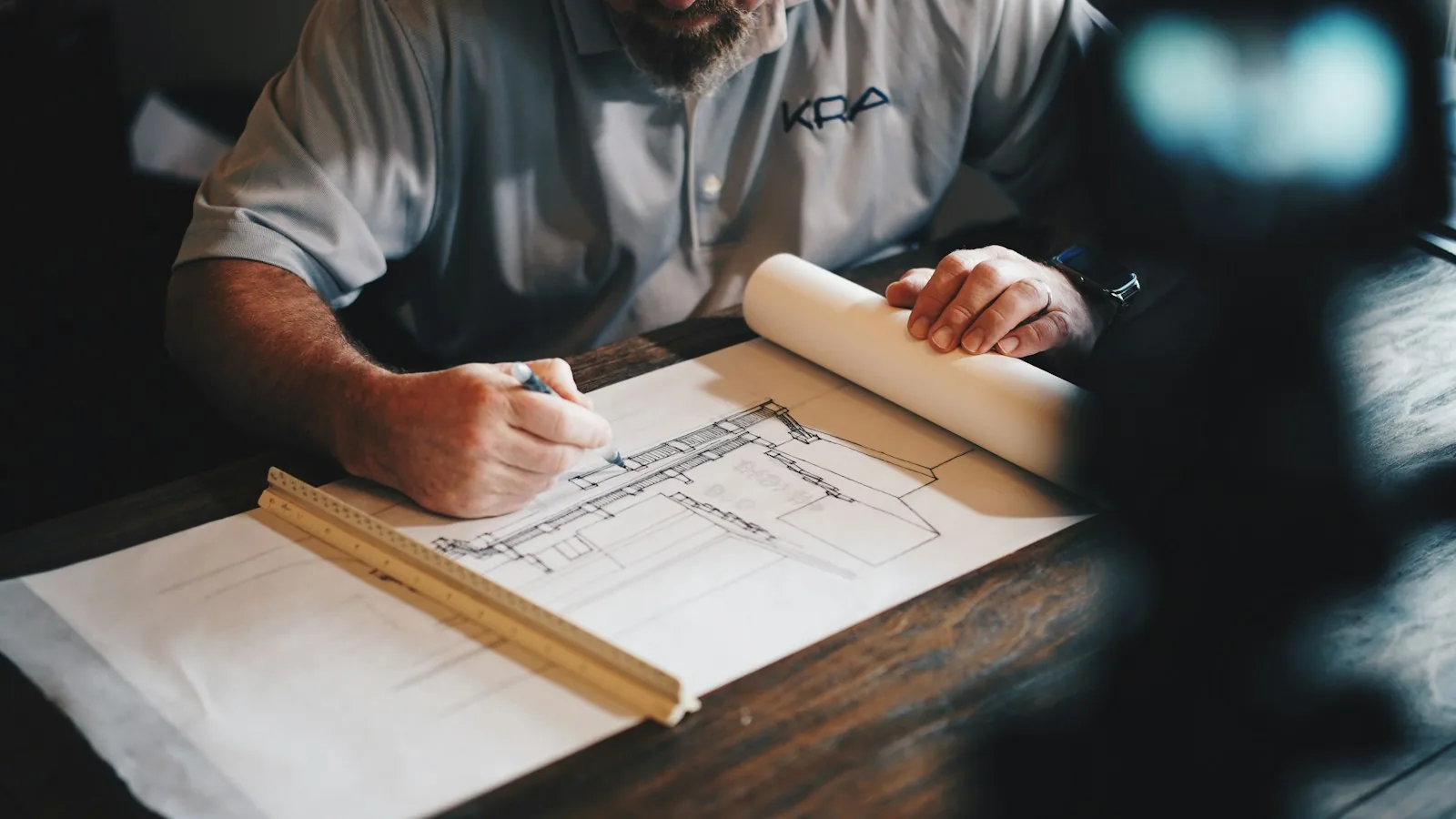 An architect drawing a plan by hand