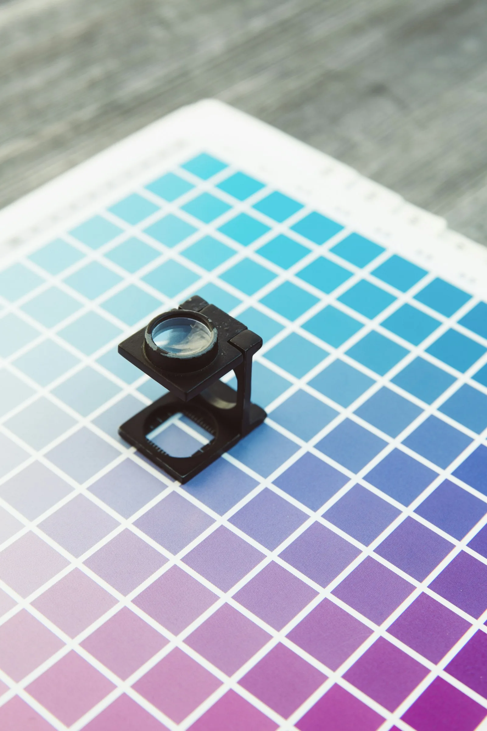 A printer’s loupe on colour proofs