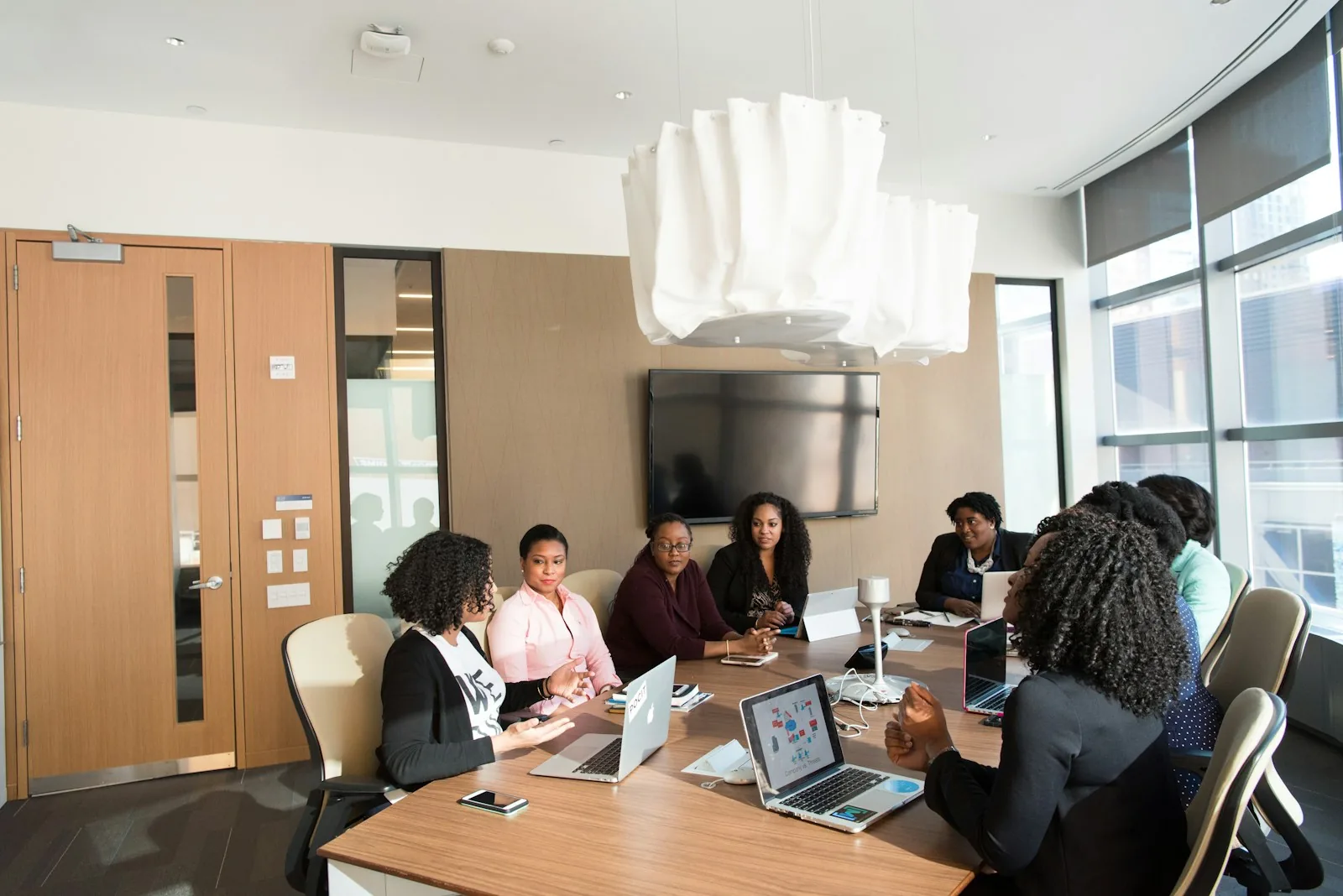 A team gathered in a bright room