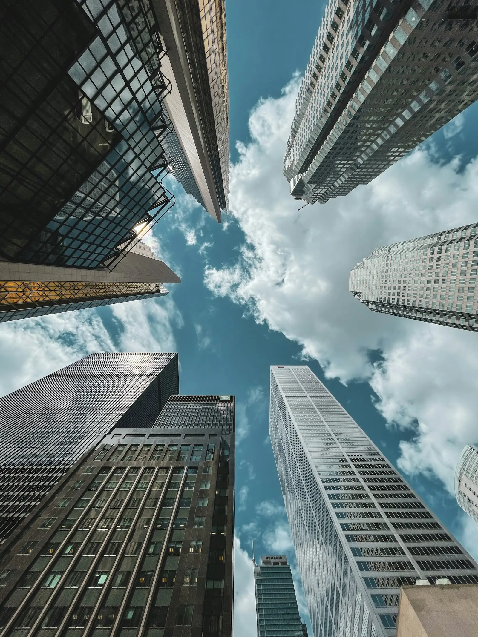 Office towers rising into a blue sky